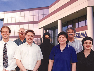 A 1996 photo of Azuma Copier employees, including Tenchumaru (center).